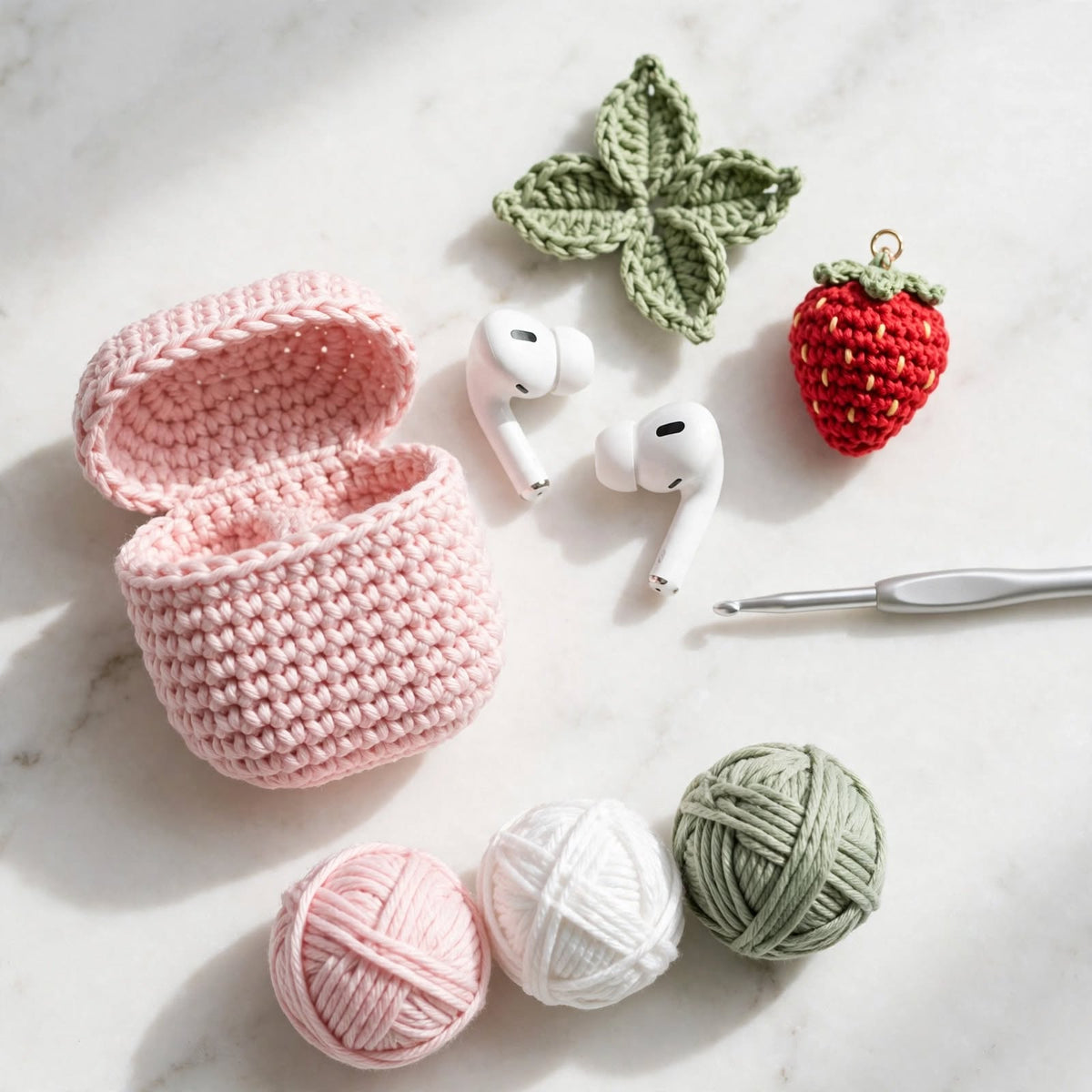 Handmade Crochet AirPods Case – Ice Pink with Green Leaves & Strawberry Charm