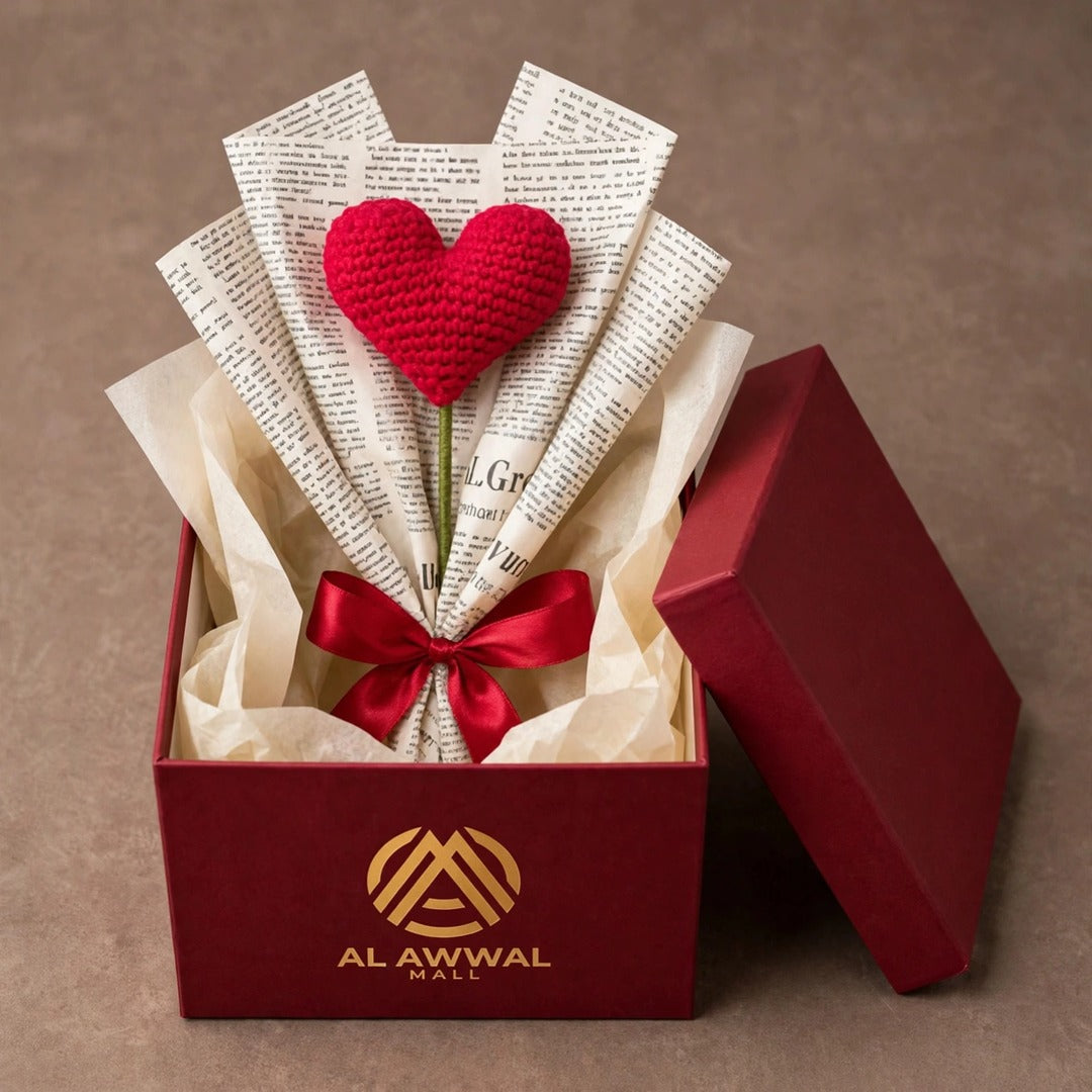 Single Heart-Shaped Flower with Newspaper Wrapping and Red Ribbon Bow