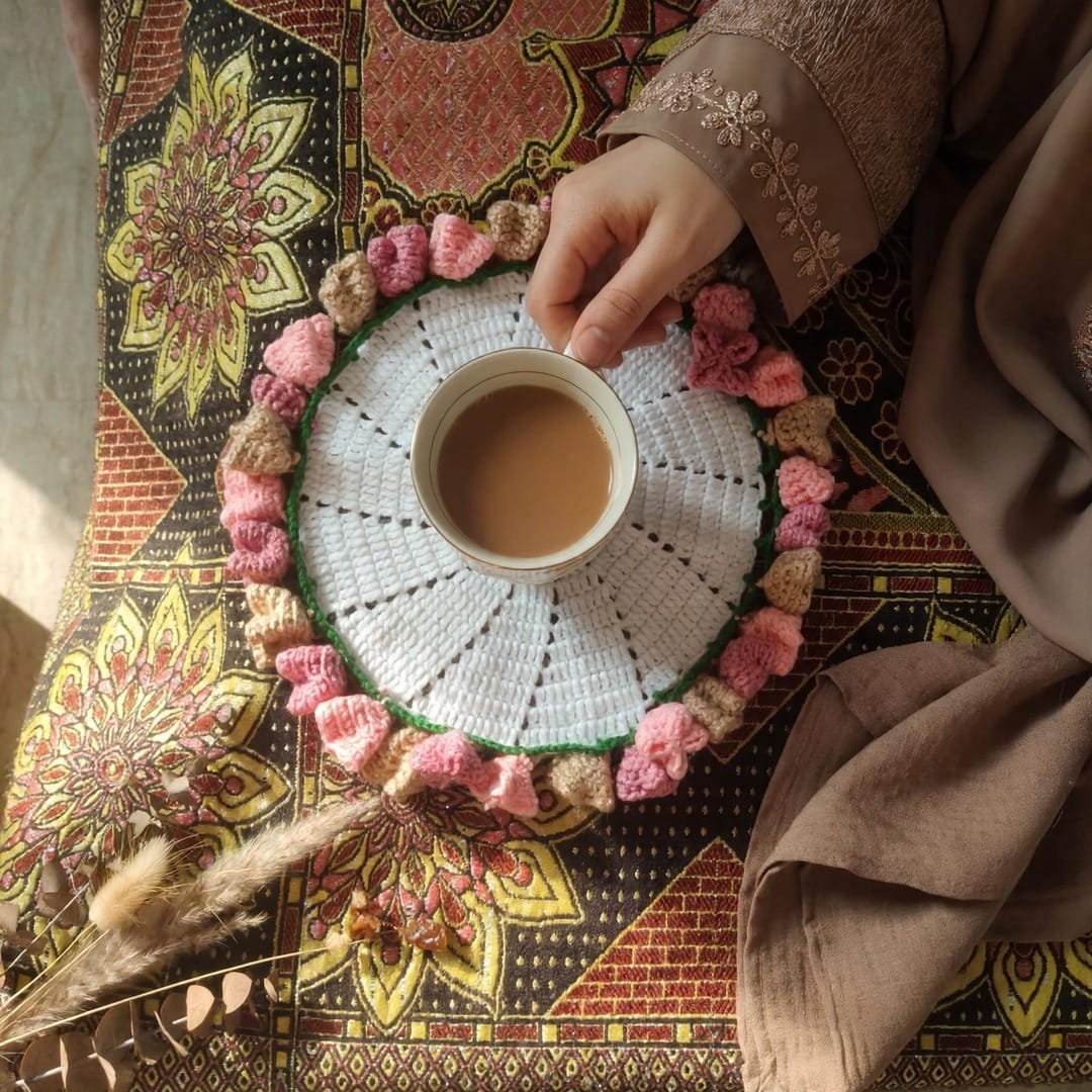 Handmade Crochet Cup Coaster with Pink Floral Border and Bright Center