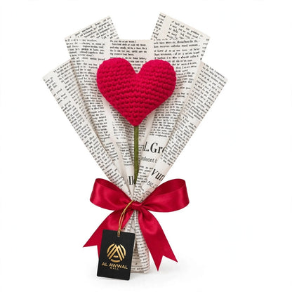 Single Heart-Shaped Flower with Newspaper Wrapping and Red Ribbon Bow