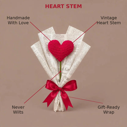 Single Heart-Shaped Flower with Newspaper Wrapping and Red Ribbon Bow
